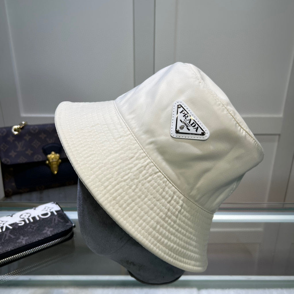 Re Nylon Shearling Trimmed Bucket Hat in White - Prada